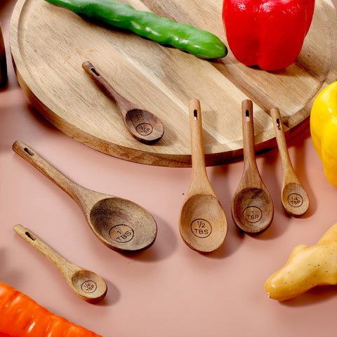 Xyembu oval spoon head in small containers for precise scooping.