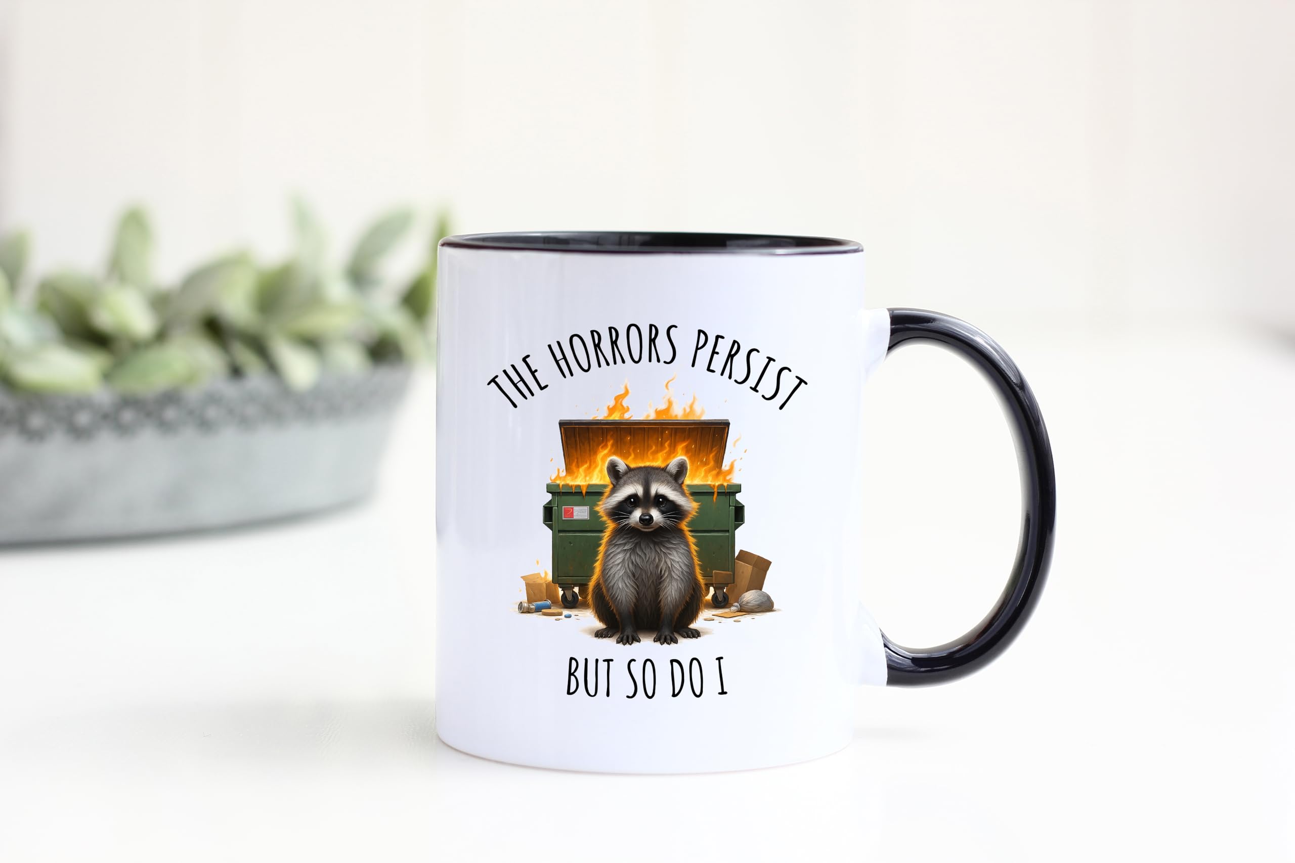 Yalocib defiant raccoon illustration mug inspires resilience at coffee time.