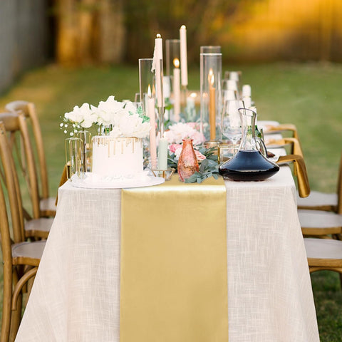 Yblut light gold satin table runner laid across banquet table for cohesive decor.