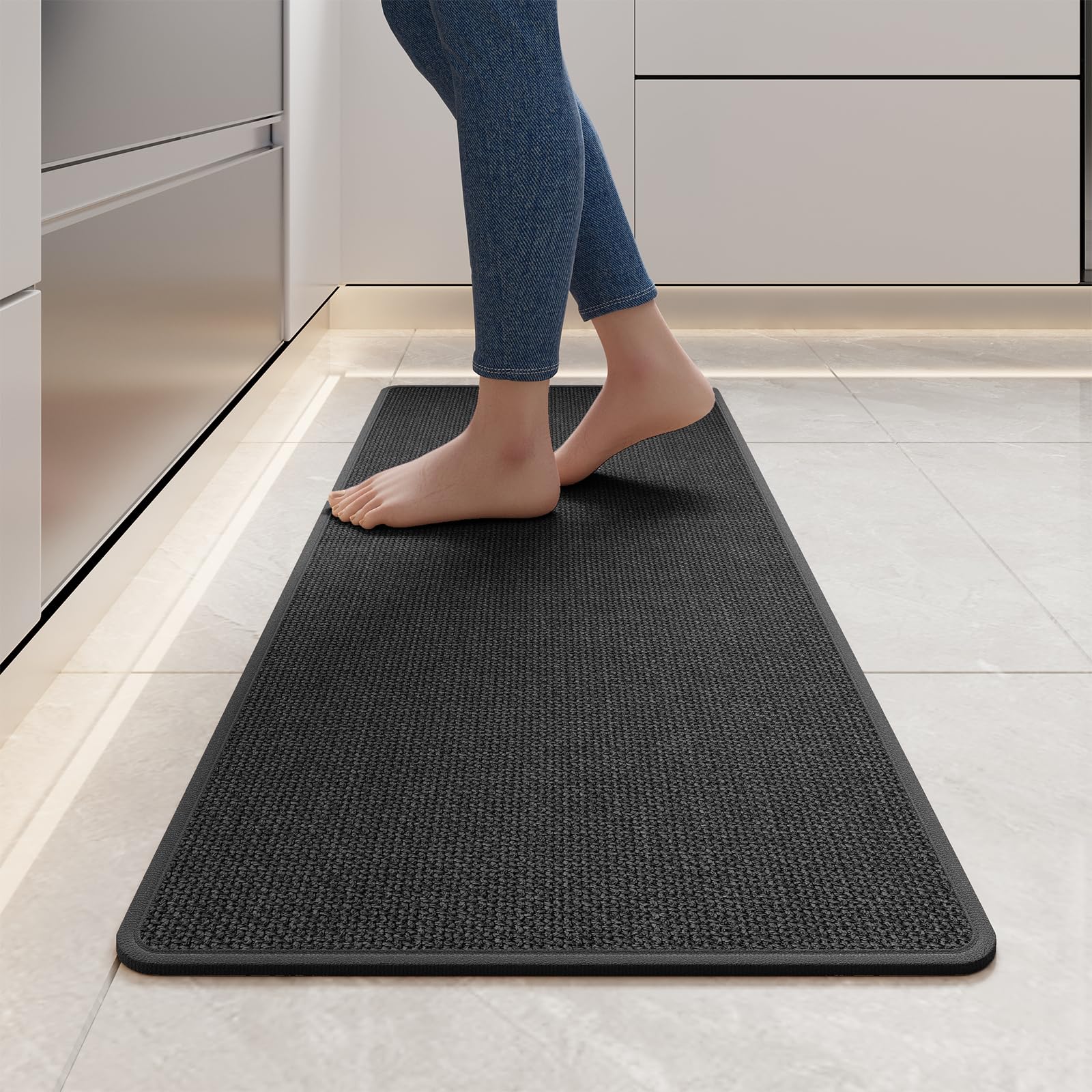 YDKGL standing mat in black reduces foot fatigue during cooking tasks.
