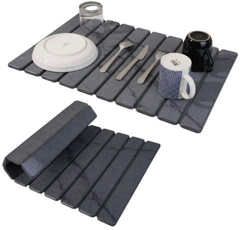 Yenyra stone drying mat on kitchen counter, dark gray finish; absorbs water quickly.