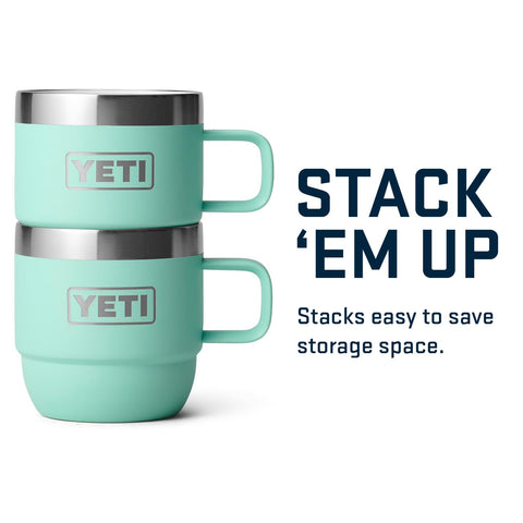 YETI Rambler 6 oz Stackable Mug seafoam beside camp gear for rugged outdoors coffee.