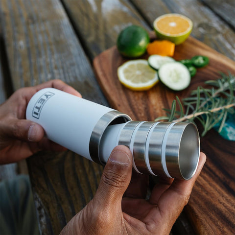 YETI shot glasses in blue camo used on a boat for post-adventure toasts