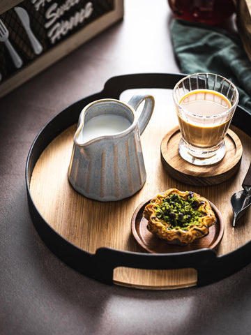 YHOJOY creamer pitcher displays a soft gray glaze and striped design.
