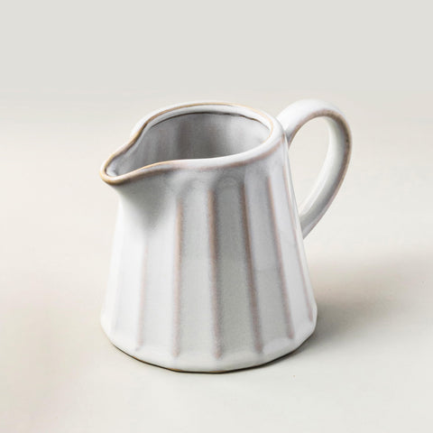 YHOJOY ceramic creamer pitcher with 10 oz capacity for precise, mess-free pours.