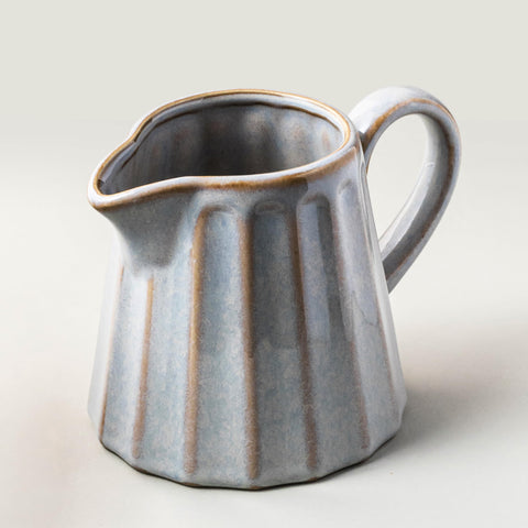 YHOJOY ceramic creamer pitcher 17oz with handle for milk and cream pours smoothly.