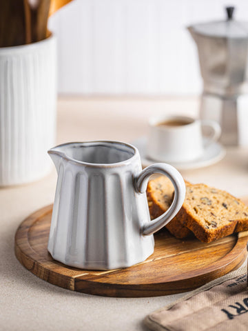 YHOJOY creamer pitcher handle close-up shows comfortable grip for easy pouring