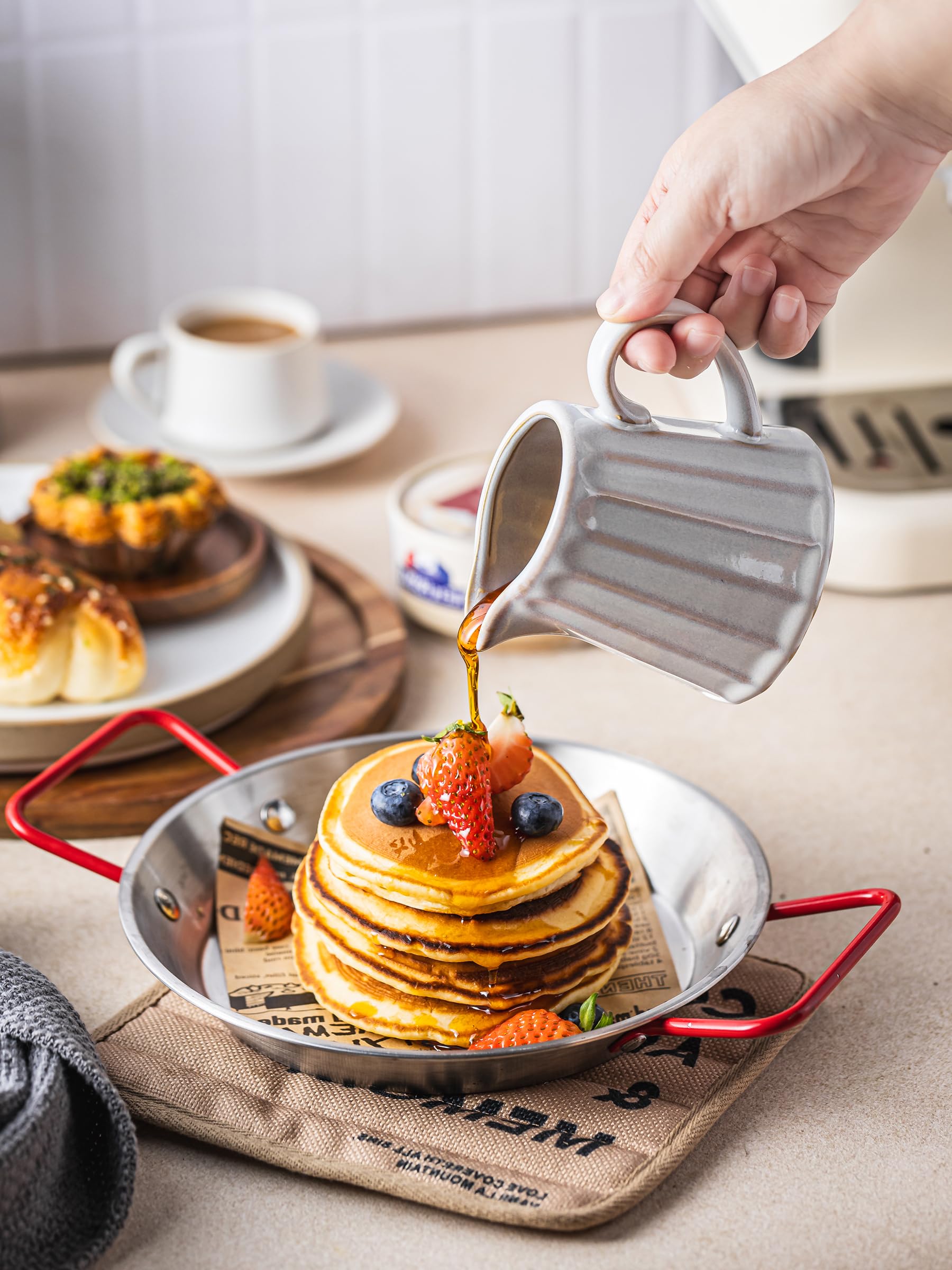 YHOJOY striped ceramic creamer pitcher with rustic rim enhances cozy kitchen moments.