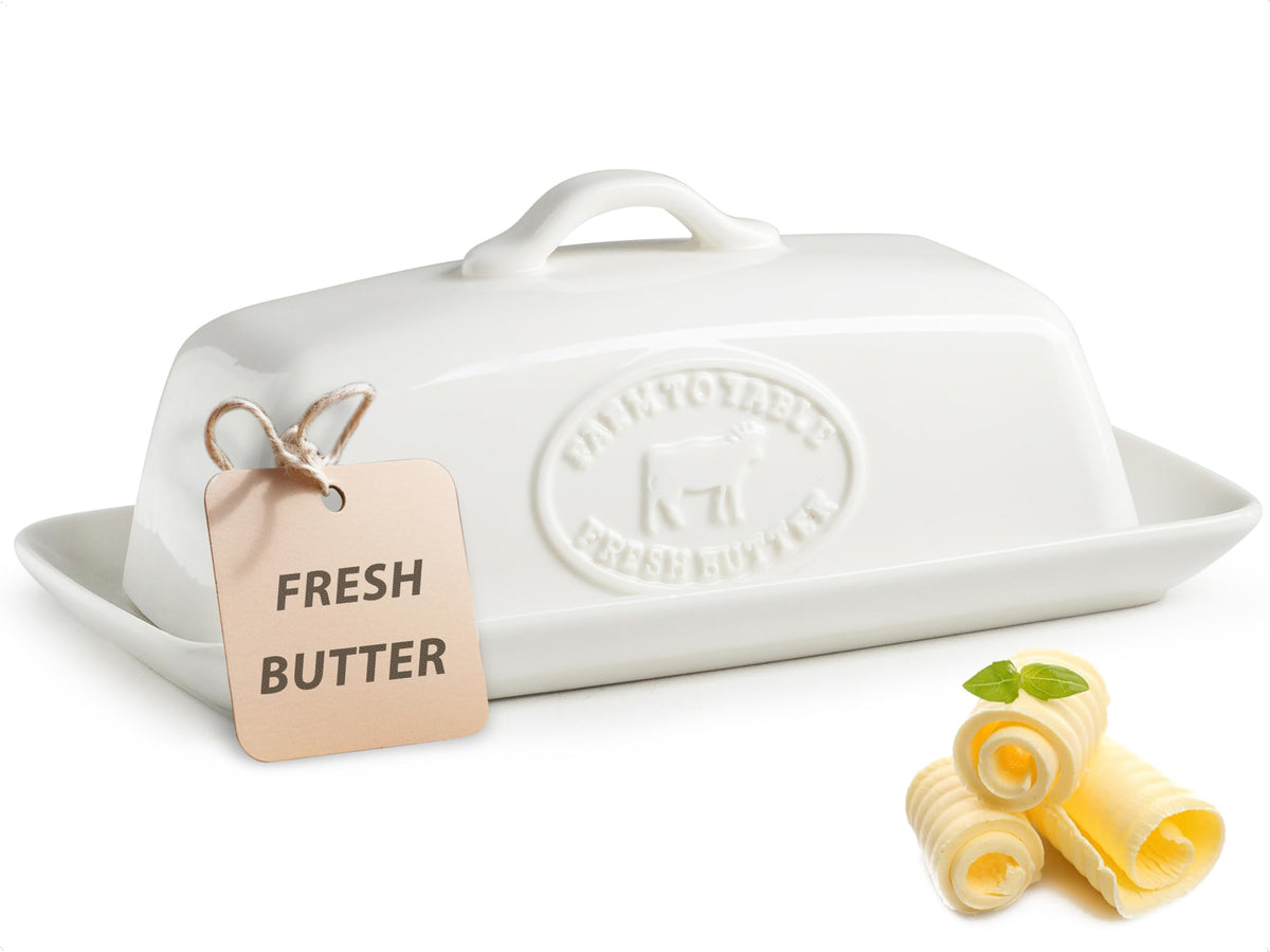 YHOJOY Cow Butter Dish with lid on countertop keeps butter fresh for daily use.