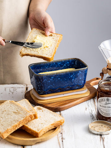 YHOJOY dishwasher-safe ceramic base; wooden lid requires hand washing