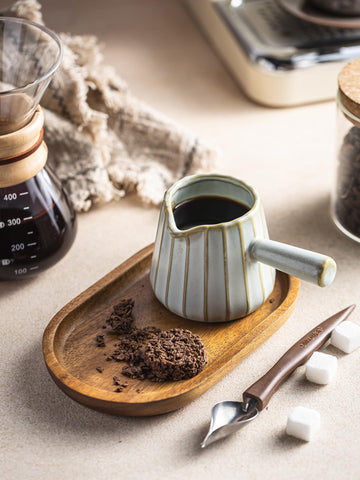 YHOJOY versatile cup suited for coffee, sauces, and dressings in kitchen