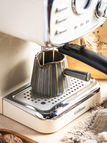 YHOJOY cup versatile for measuring and serving sauces or dressings.