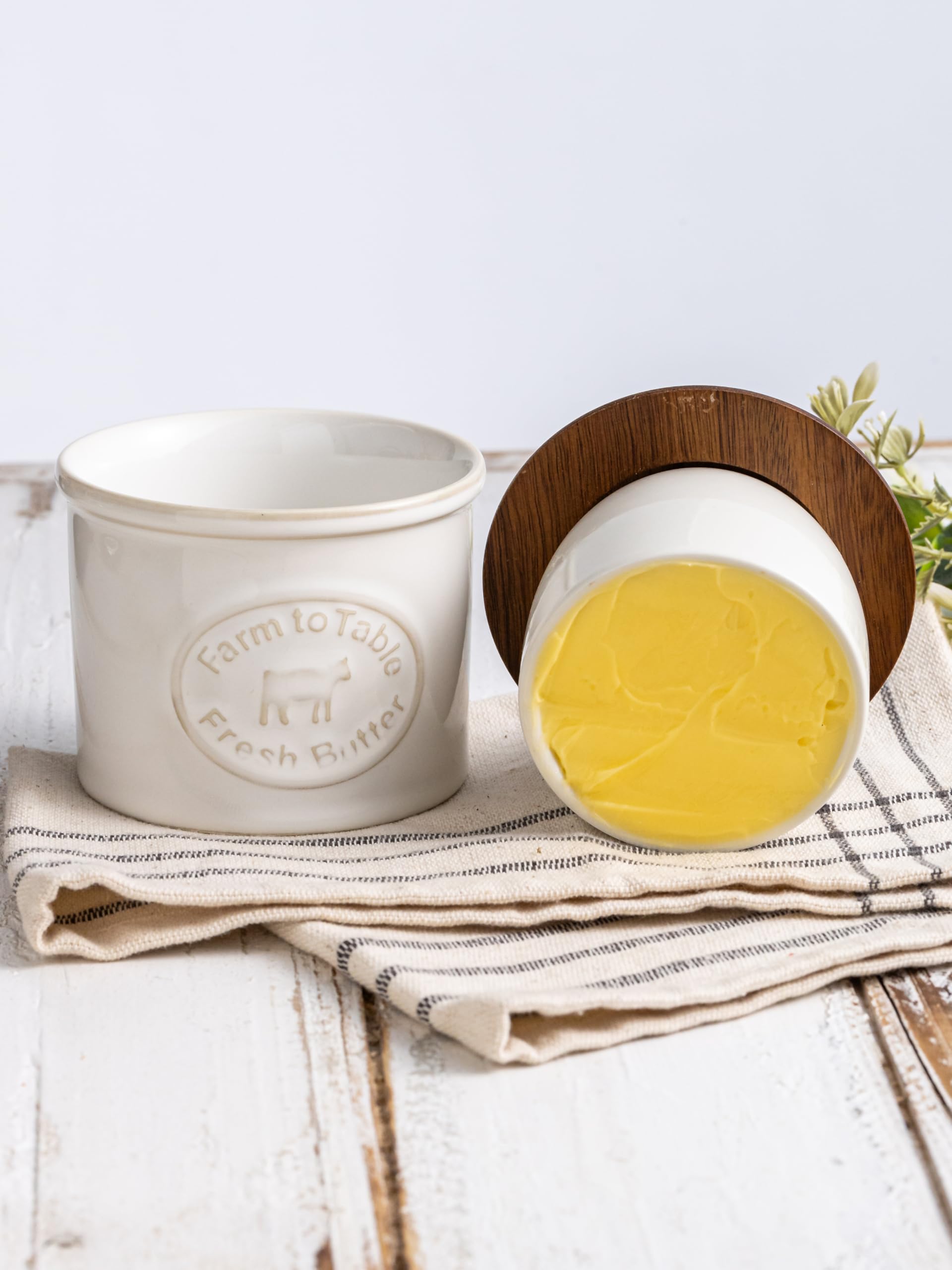 YHOJOY French butter keeper on counter with wooden lid and stylish detail.