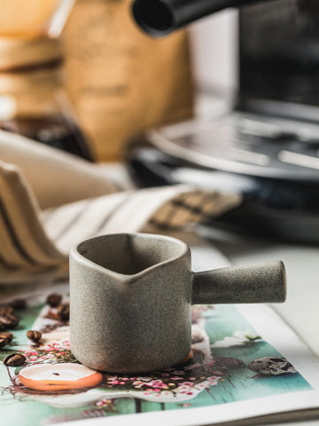 YHOJOY gray ceramic coffee measuring cup blends with kitchen decor.