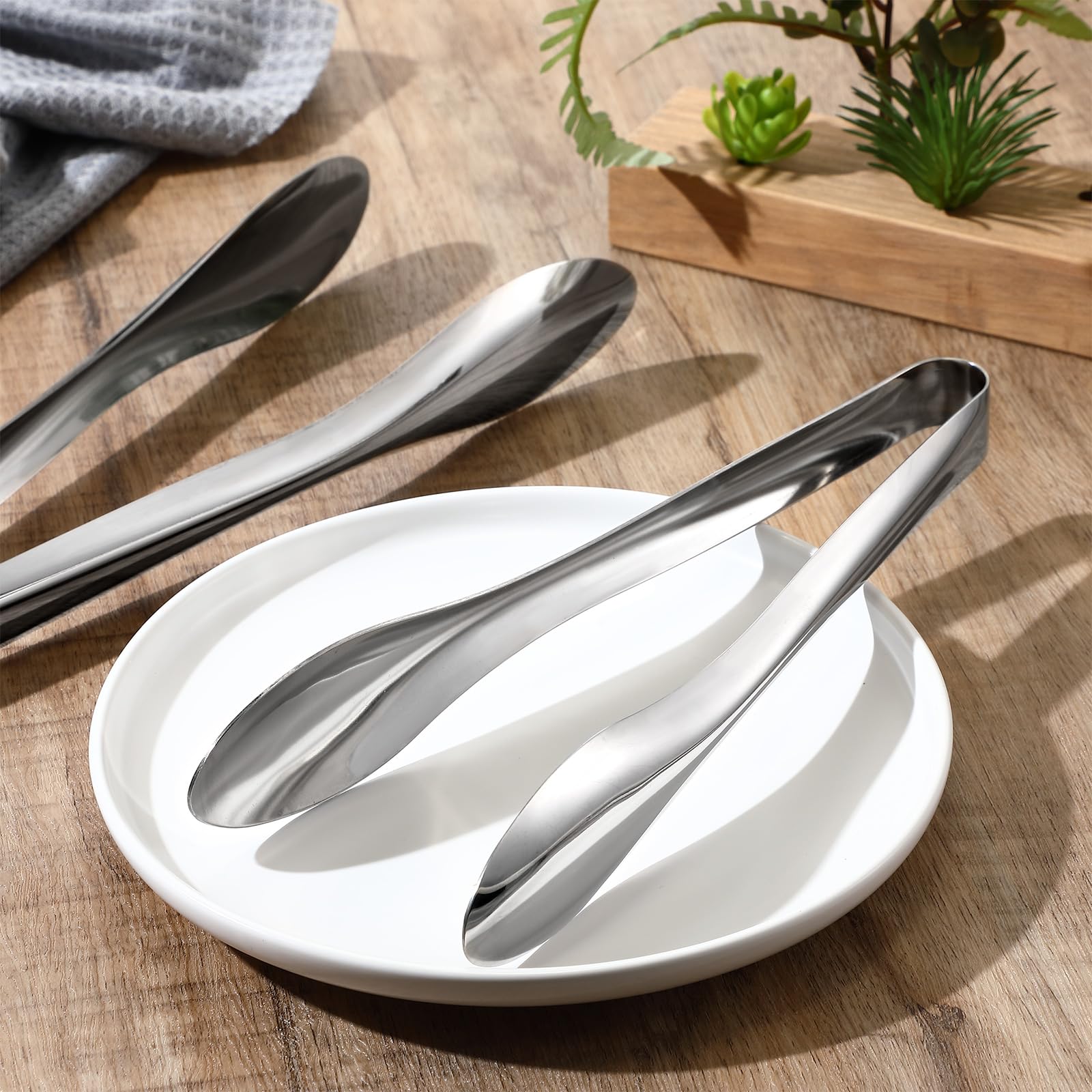 Yiyiring tongs displayed on a buffet table for elegant serving