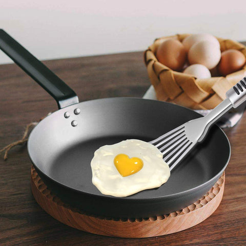 YK GDYORKITCHEN Premium Fish Spatula turning eggs without sticking in a skillet.