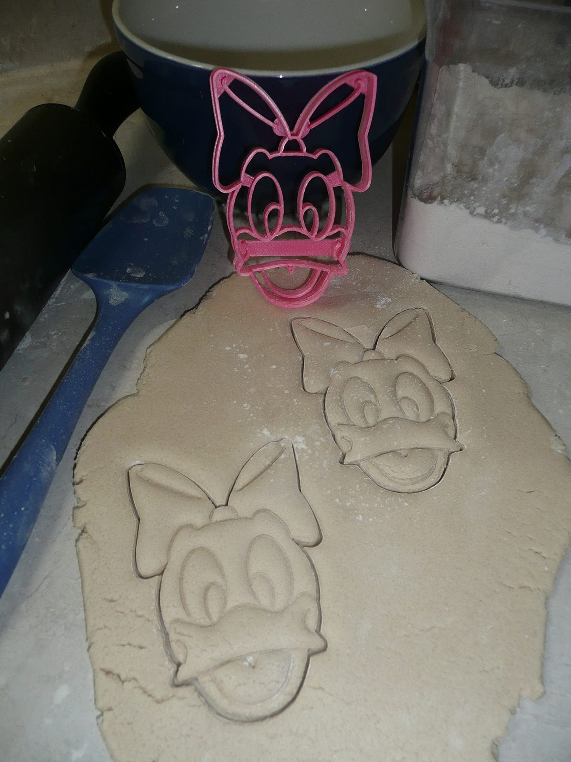 YNGLLC cookie cutters pressed into dough with clear edge cuts