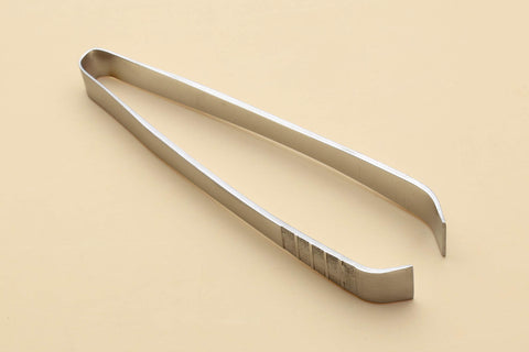 Yoshihiro non-slip fish bone tweezer tip close-up shows secure grip for delicate work