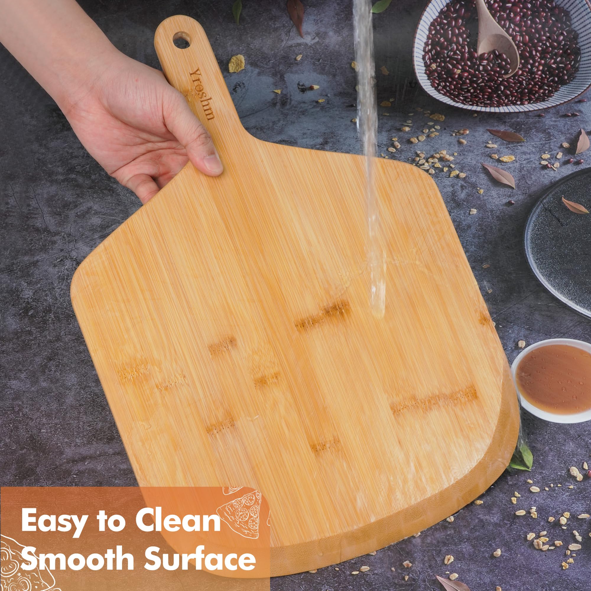 Yroshm bamboo pizza peel on oven stone ready to slide.