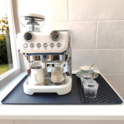 Yudevey silicone coffee mat 24x16 protects countertops from heat, stains, and scratches.