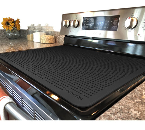 YUHFERA stove top cover on a glass top protects surface and adds prep space.