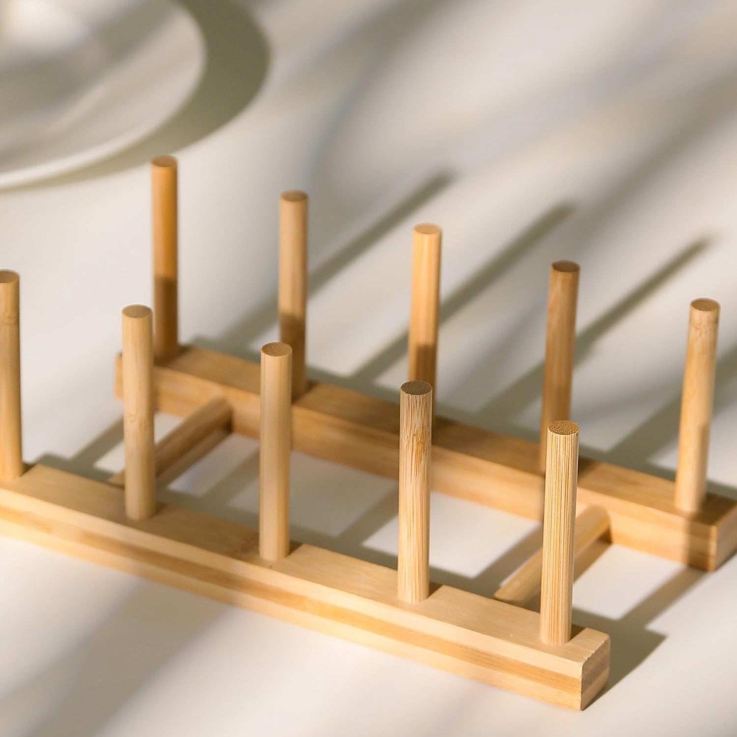 Yuixoseu bamboo dish rack used for cups, lids, and small bowls.