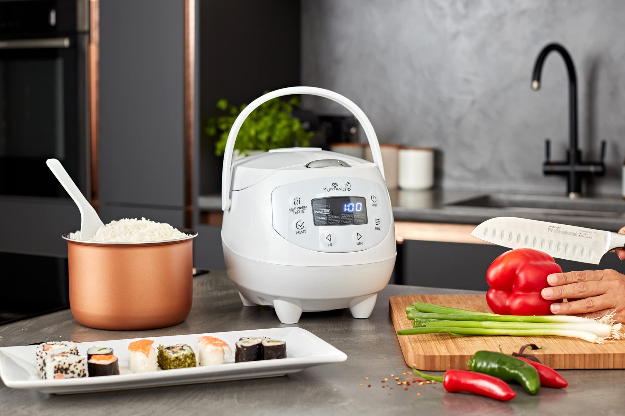 Steaming basket in use with Yum Asia Panda Mini Rice Cooker for healthy meals
