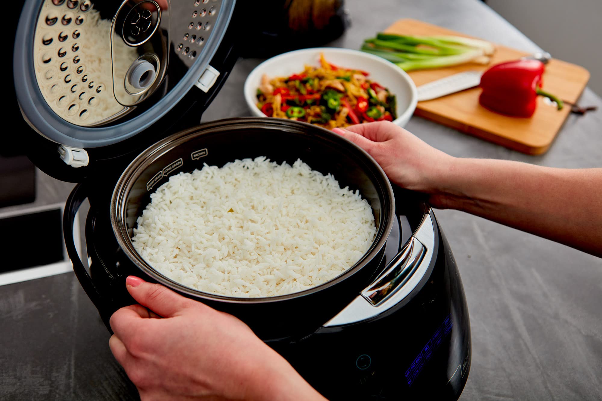 Yum Asia Sakura 3D LED display guides timers and cooking modes.
