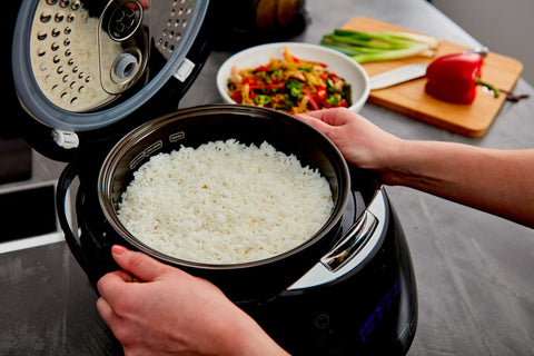 Yum Asia Sakura 3D LED display guides timers and cooking modes.