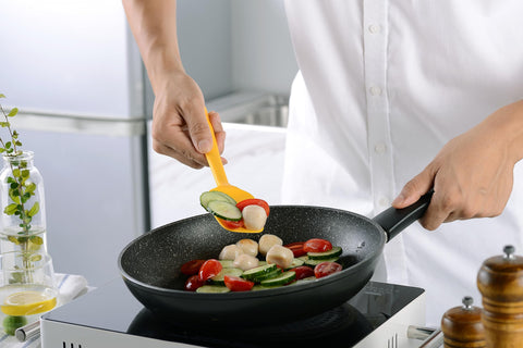 YunWuCloud silicone spoon in yellow, versatile stirring and scooping with nonstick care.