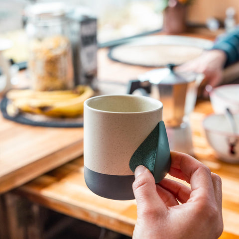 YY Vertical Climbing Mug Evo demonstrates grip training alongside daily drink.
