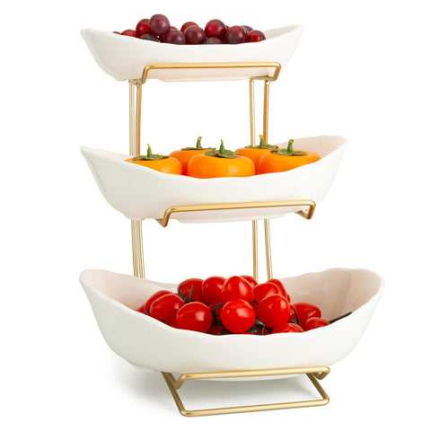 YYW fruit stand on a counter holding fruits and snacks in a decorative display