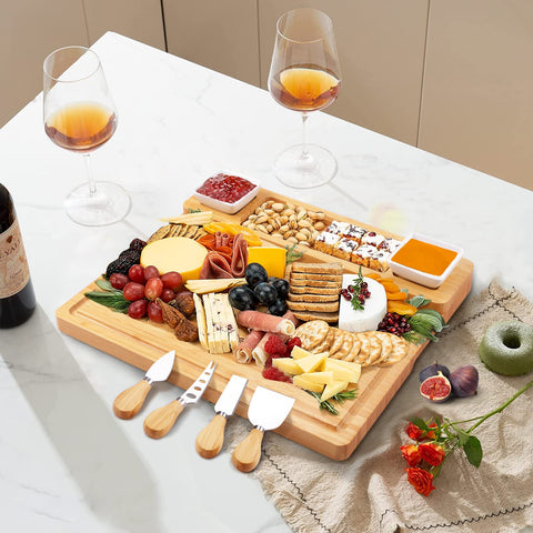 YZS Housm charcuterie board on table with wine and meats for entertaining.