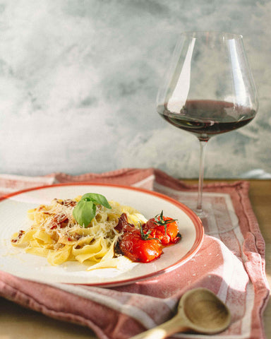 Zalto Denk'Art Burgundy red wine glass showcases bold red notes in use.
