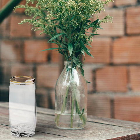 Zanzer 13-25oz gold glass cup in use with a refreshing beverage