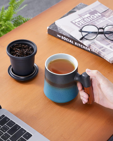 ZENS gradient blue cup with wood handle offers comfortable grip and heat protection.