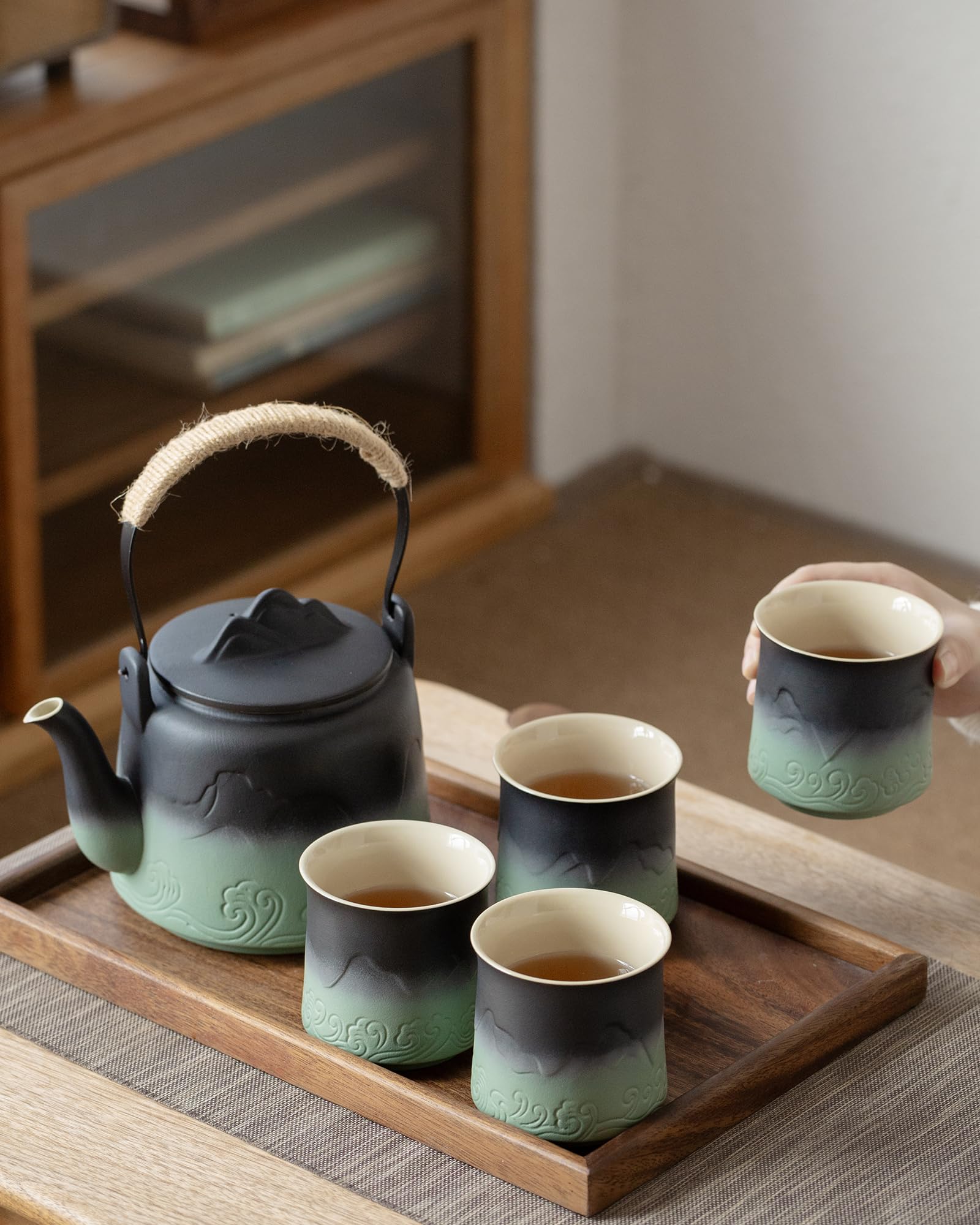 ZENS gradient glaze teapot enhances tea party decor.