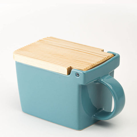 Zero Japan Bee House salt box with open lid for easy one-handed access on counter.