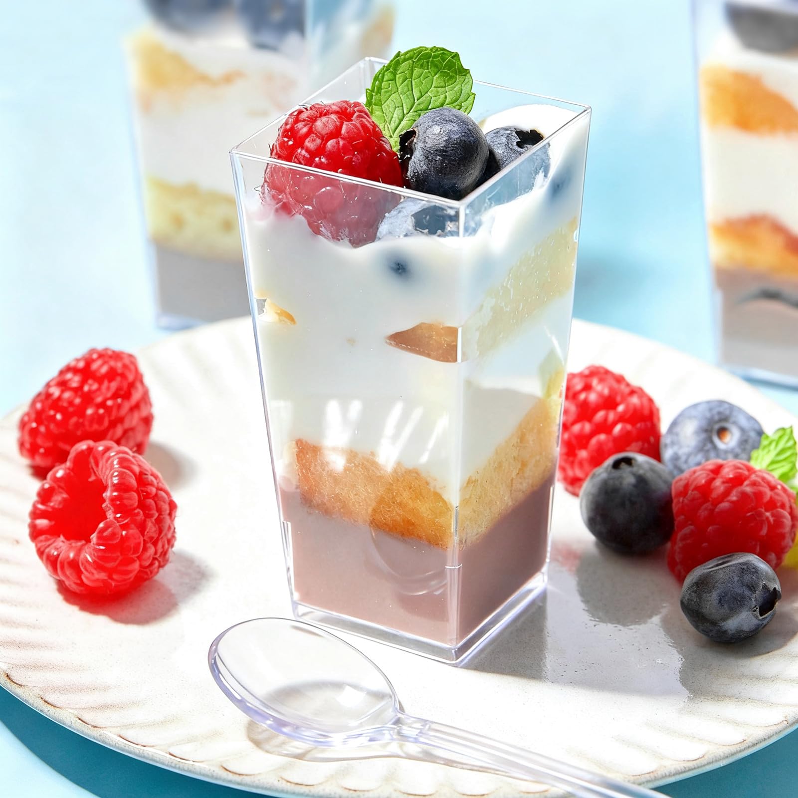 Zezzxu cups holding mousse and pudding on a stylish dessert table.