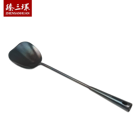 ZhenSanHuan hand-hammered iron spatula shows artisanal texture for robust use.