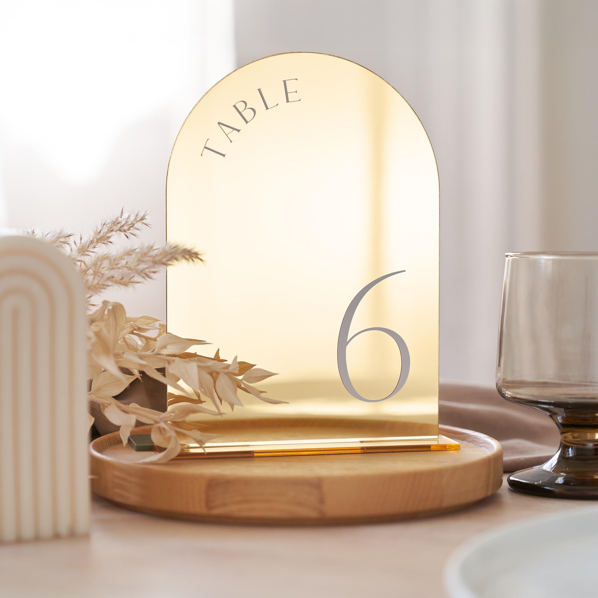 ZICOTO gold wedding table numbers with stands help guests find their tables.