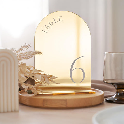 ZICOTO gold wedding table numbers with stands help guests find their tables.