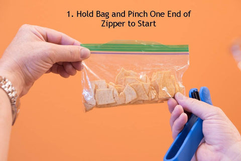 ZipSealer in-use kitchen helper seals bags quickly.