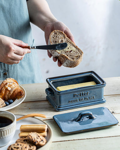 Zoeeker butter dish on the countertop adds farmhouse warmth to gatherings.