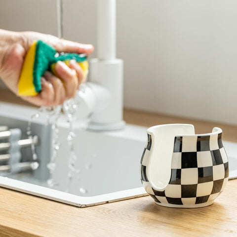 Zoeeker farmhouse-style sponge holder in black and white complements kitchen decor.