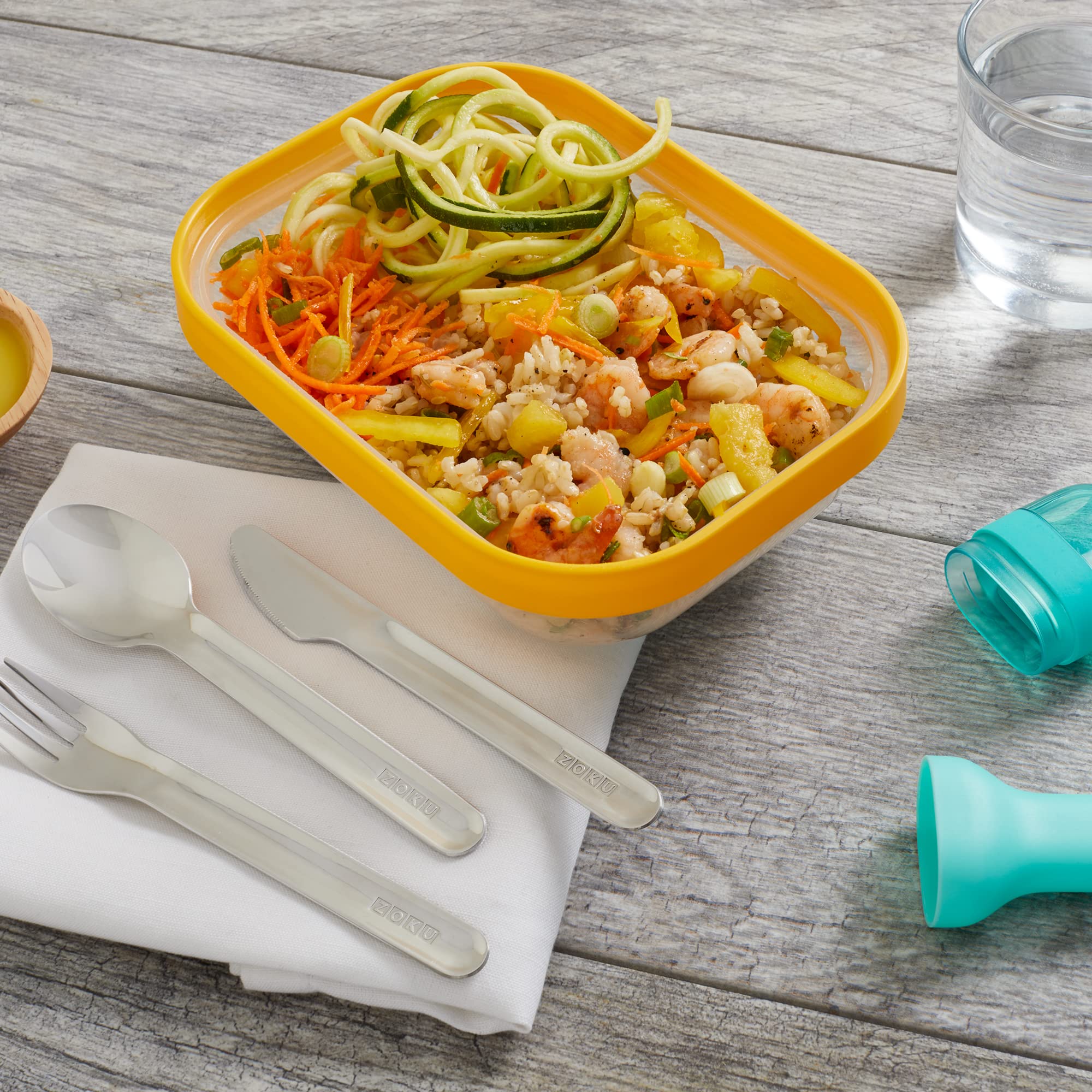 ZOKU teal utensil nest saves space in bags