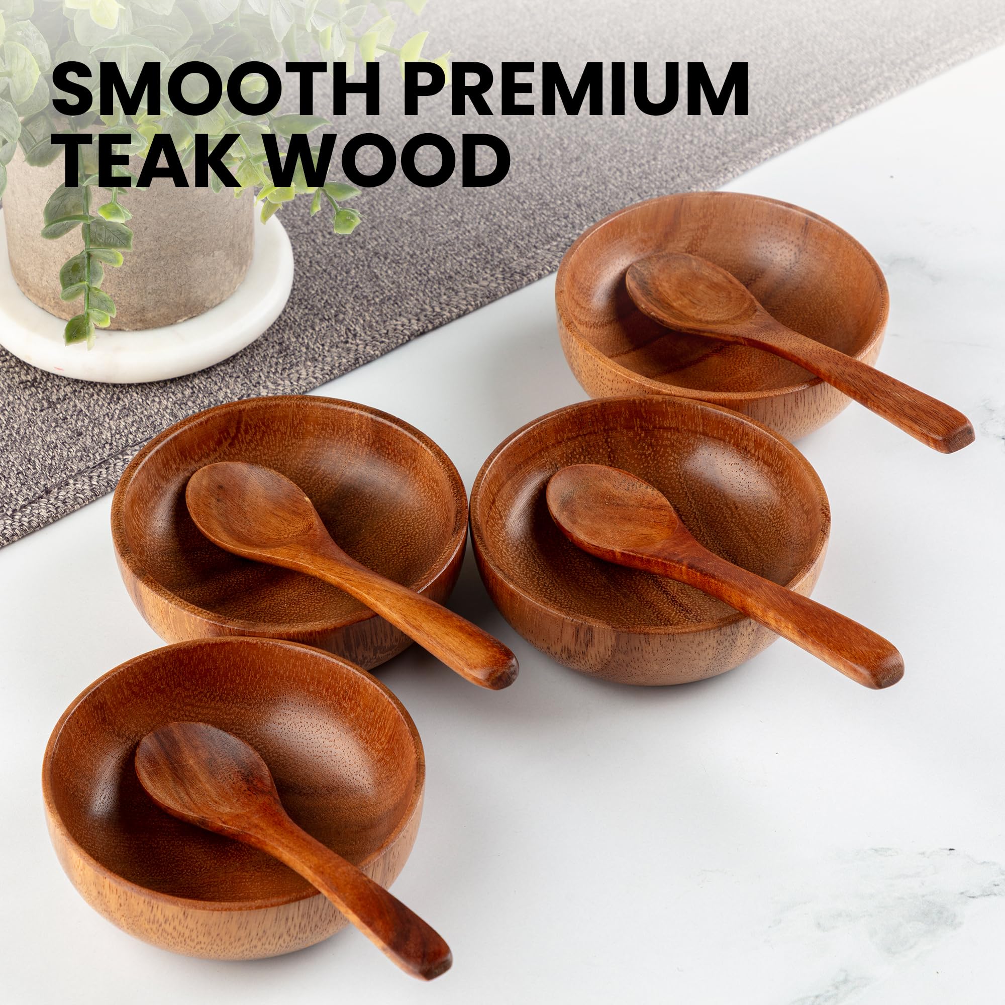 Zulay Kitchen 8-piece teak set presented on a serving board for elegant table display.