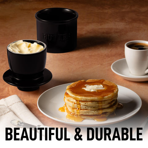 Zulay Kitchen butter crock with lid on black bell shape for a polished look.