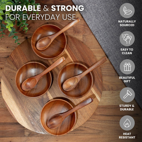 Close-up of Zulay Kitchen teak dipping bowls with smooth edges and rich grain.