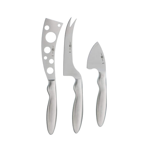 ZWILLING Collection 3-piece cheese knife set on a charcuterie board for versatile cheese prep.